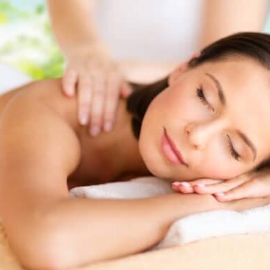 close up of beautiful woman having massage at spa